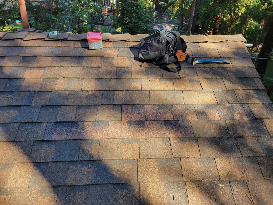 Repaired roof with new shingles