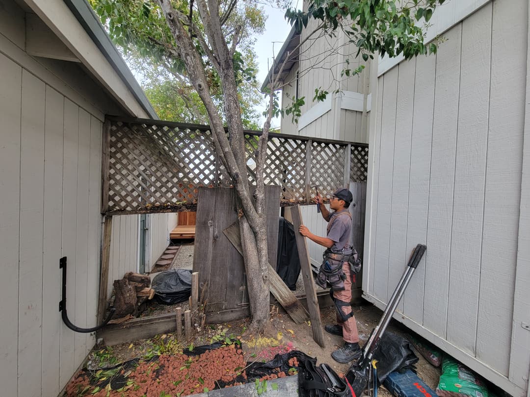 Man building a fence